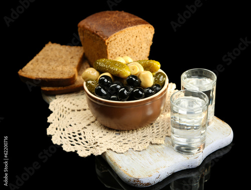 Composition with glasses  of vodka, and marinated  vegetables,