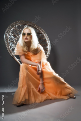 Soft focus retro hippie 70s fashion sensual girl with long blond