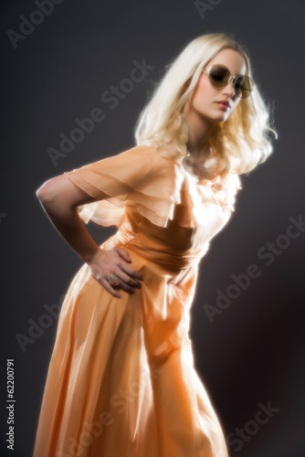 Soft focus retro hippie 70s fashion sensual girl with long blond