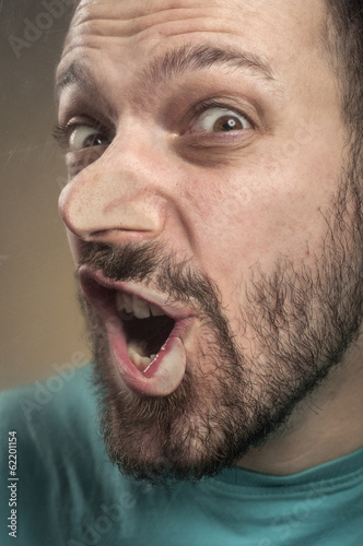 Funny Faces - Man Blowing Against the Glass Surface