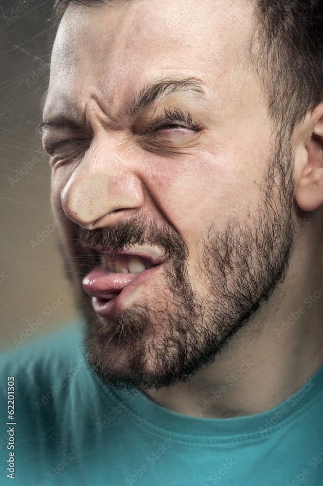 Obraz premium Funny Faces - Man Blowing Against the Glass Surface