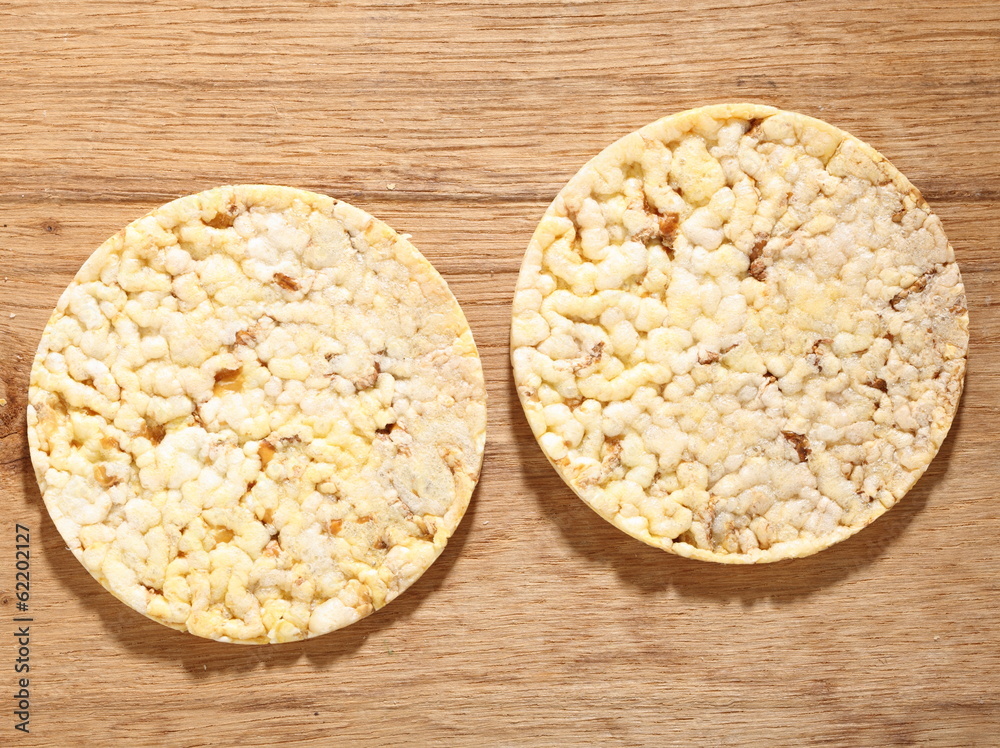 Thin round corn cakes on wooden background Thin round corn cakes on wooden background
