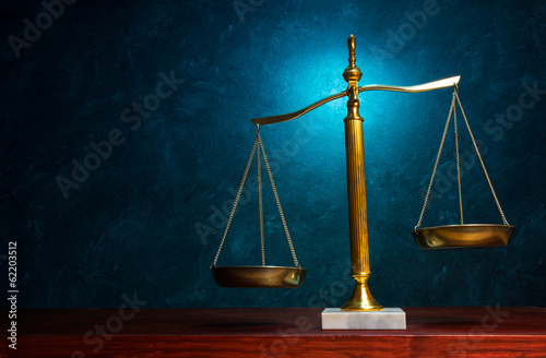 Justice scale on blue background