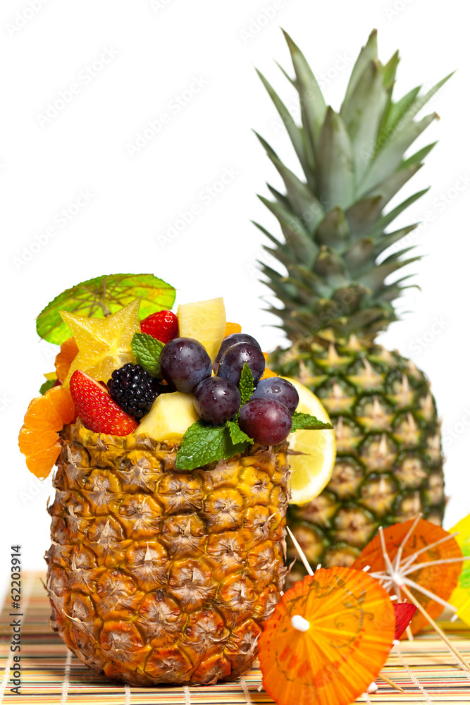Salad of pineapple, oranges and other fruits in a pineapple Salad of pineapple, oranges and other fruits in a pineapple