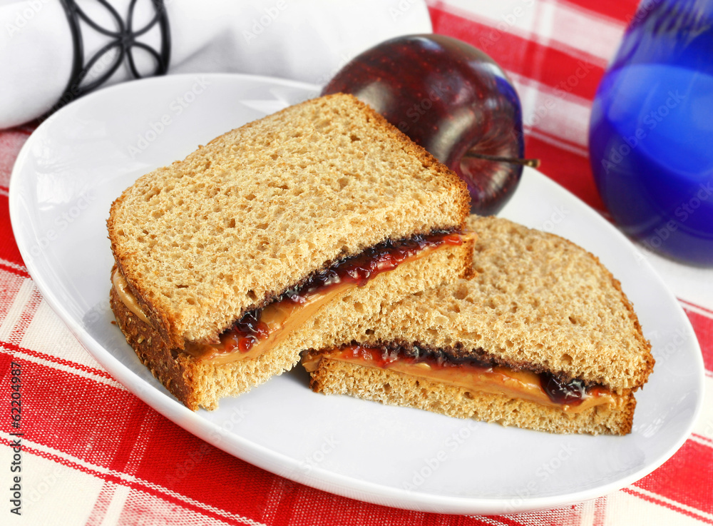 Healthy lunch of Peanut Butter and Jelly Sandwich on Whole Wheat Healthy lunch of Peanut Butter and Jelly Sandwich on Whole Wheat