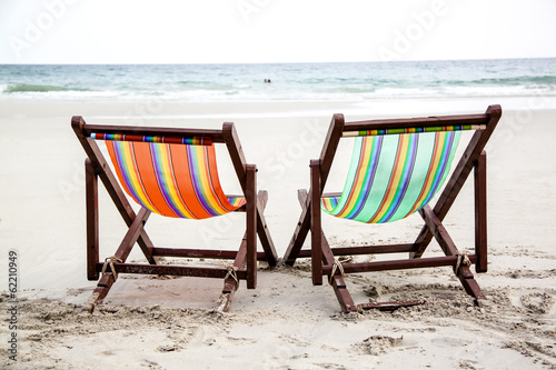 Colorful chairs at a topical beach
