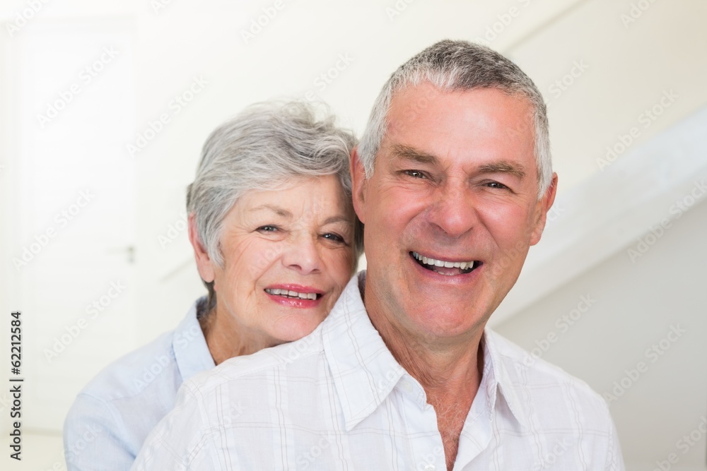 Retired couple smiling at camera Retired couple smiling at camera