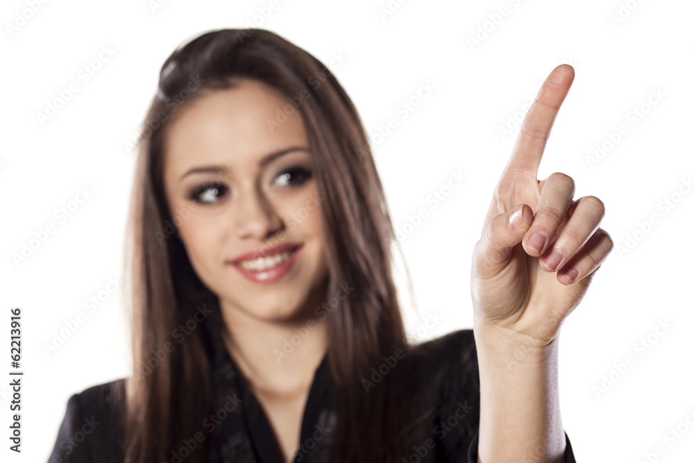 young smiling beautiful woman touching an empty space young smiling beautiful woman touching an empty space
