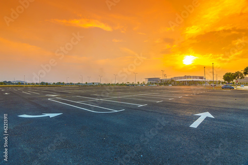 Sunset at empty parking lot photo