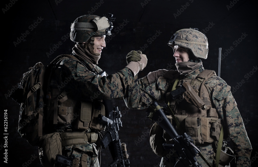 U.S. military marines congratulate each other. High five. U.S. military marines congratulate each other. High five.