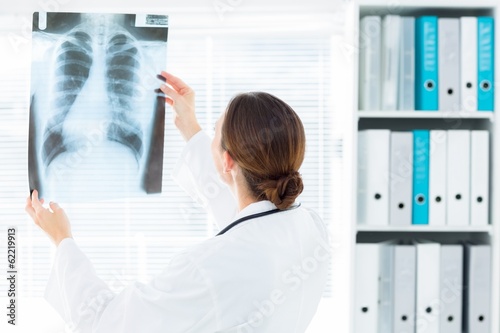 Free Download Female doctor studying Xray - GFXLoad