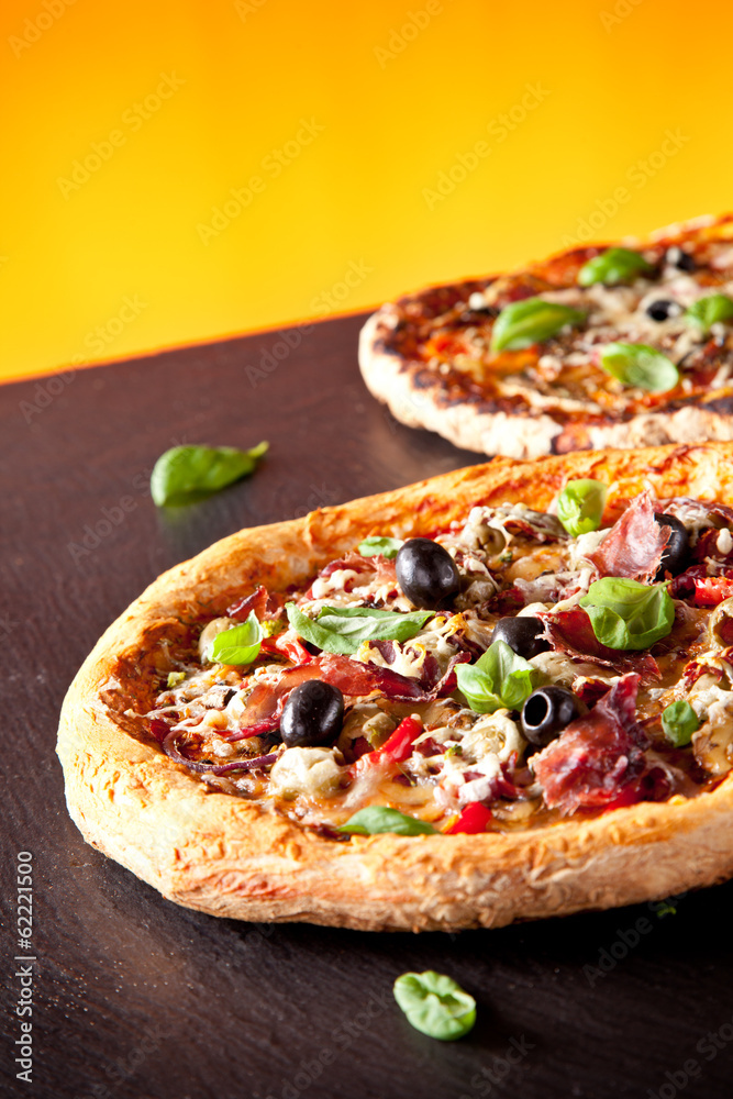Fresh italian pizza served on black stone Fresh italian pizza served on black stone