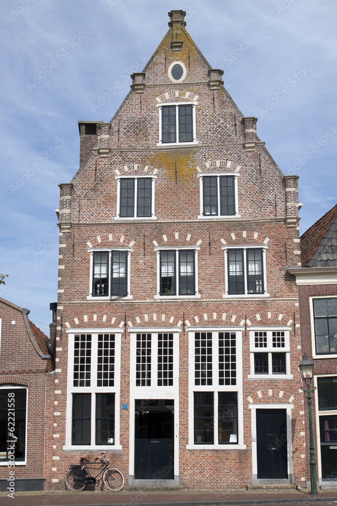 Fototapeta premium Single old house on the habour of the Dutch historic town Hoorn.