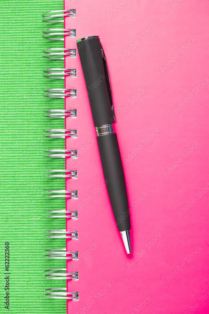 Black pen on pink notebook Black pen on pink notebook