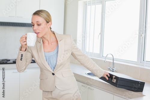Businesswoman rushing out the door to work in the morning