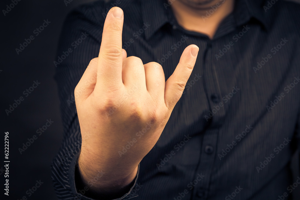 man hand giving Rock Roll sign man hand giving Rock Roll sign