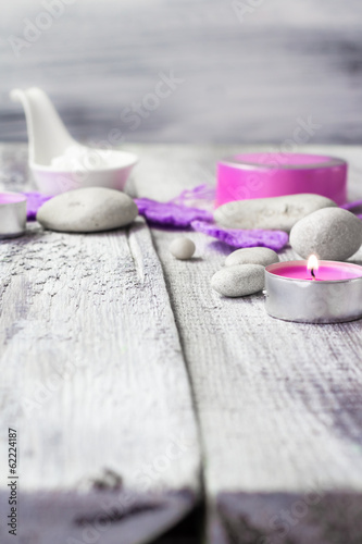 Zen stones aromatic candles wooden background