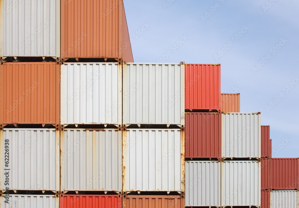 Stacked cargo containers in freight sea port terminal Stacked cargo containers in freight sea port terminal
