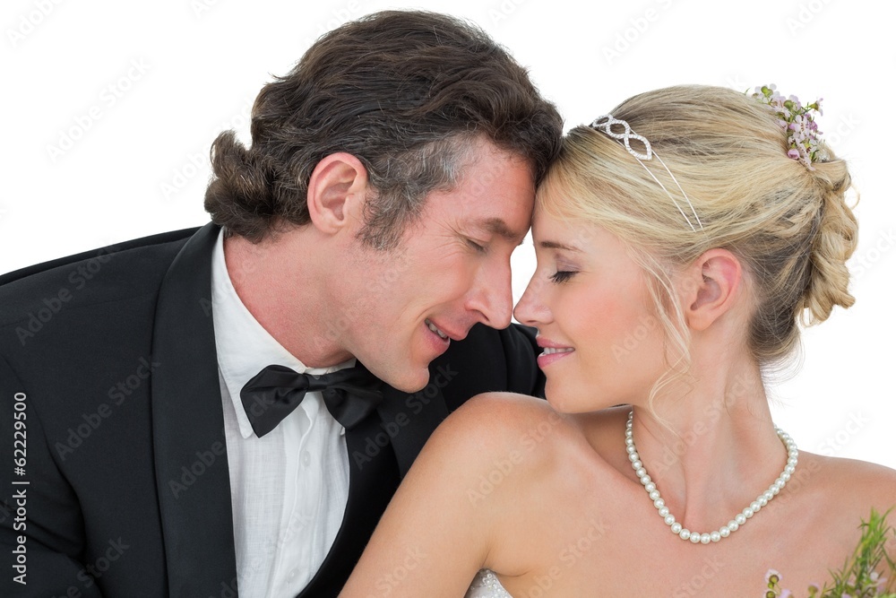 Bride and groom with head to head over white background Bride and groom with head to head over white background