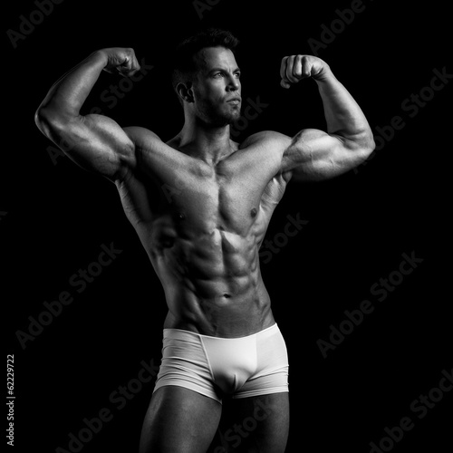 Bodybuilder on a black background