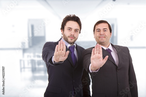 Two business men standing at the office