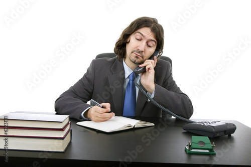 Businessman sitting at the desk, Isolated on white