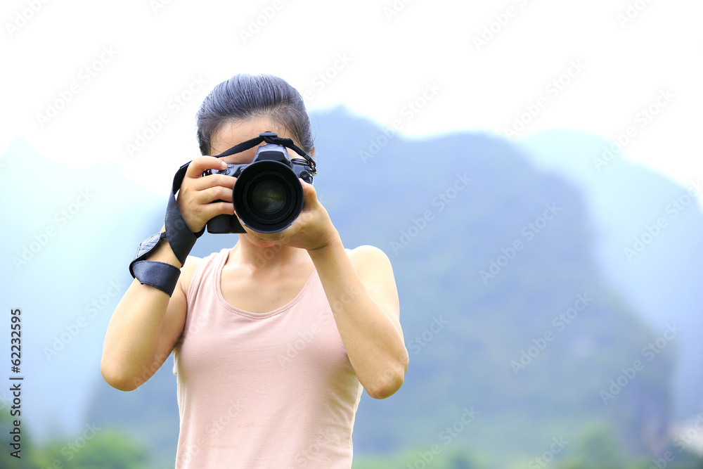 young woman photographer taking photo,yangshuo,china