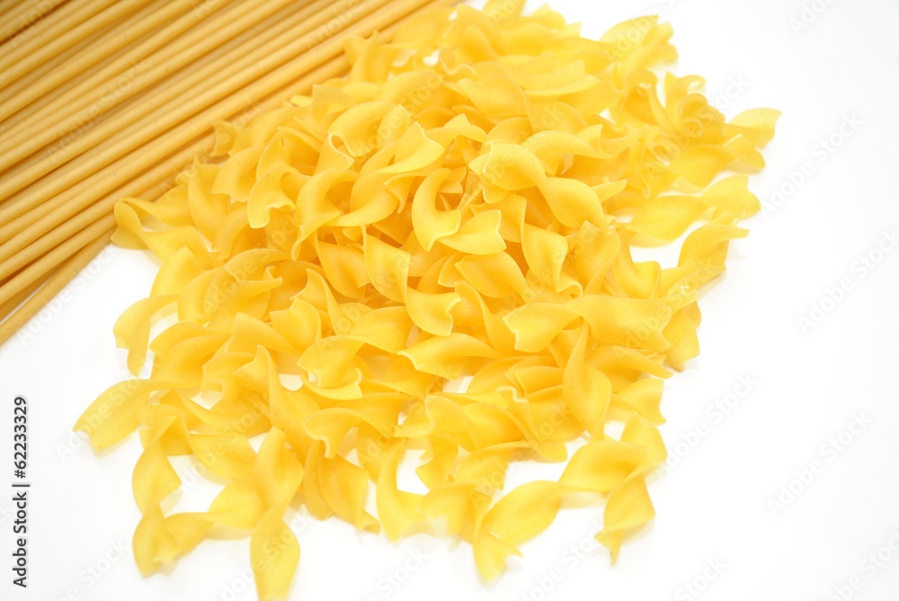Perciatelli Pasta and Egg Noodles Over White Perciatelli Pasta and Egg Noodles Over White