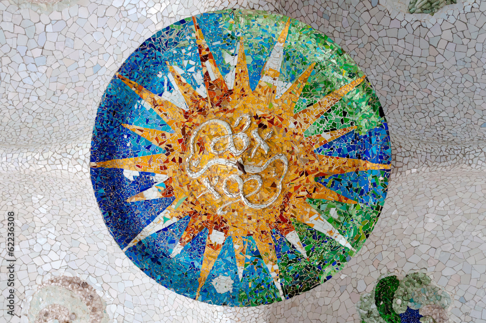 Fototapeta premium Season mosaic with orange sun at sala Hipostila in Park Guell at
