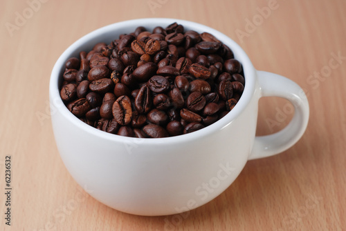 A White Cup Full Of Coffee Bean