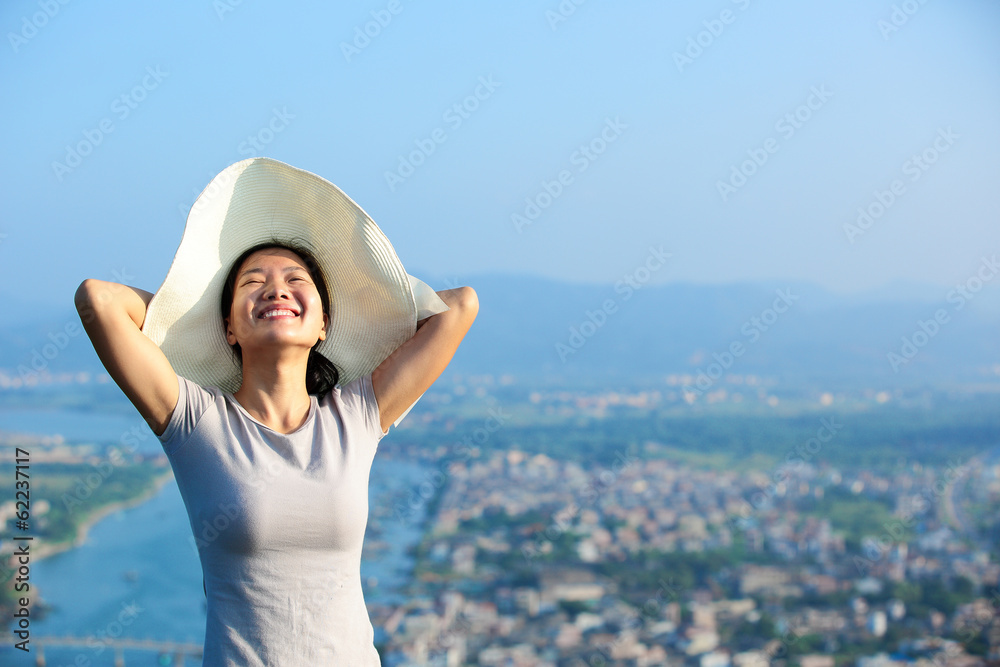 Fototapeta premium summer holiday woman enjoy the view on seaside mountain peak