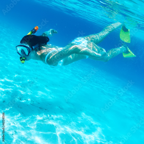 Woman with mask snorkeling