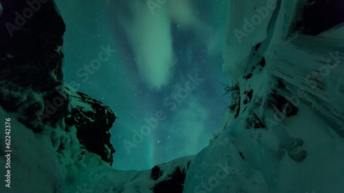 Northern lights (Aurora borealis) above snow photo