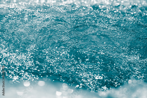 blue bubbling water from beneath the waves