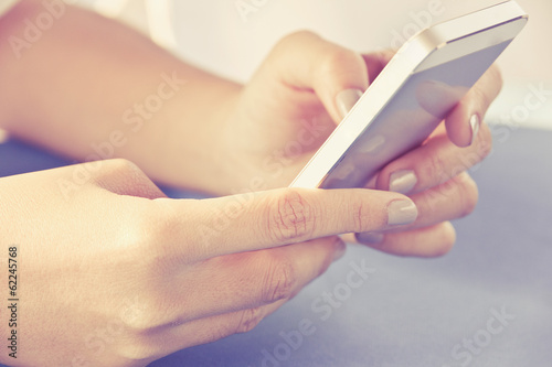 Teenage girl text messaging on her phone
