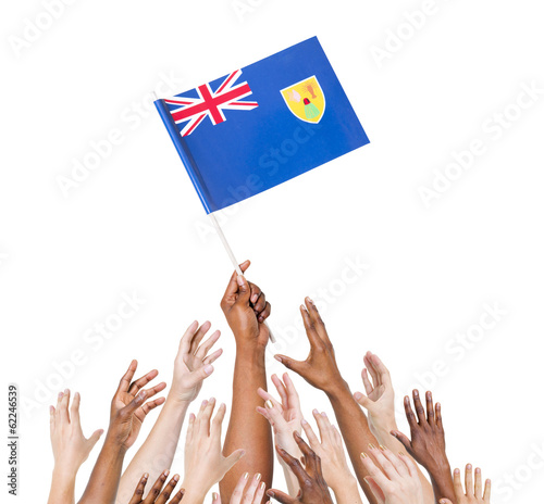Human Hand Holding Turks and Caicos Islands Flag