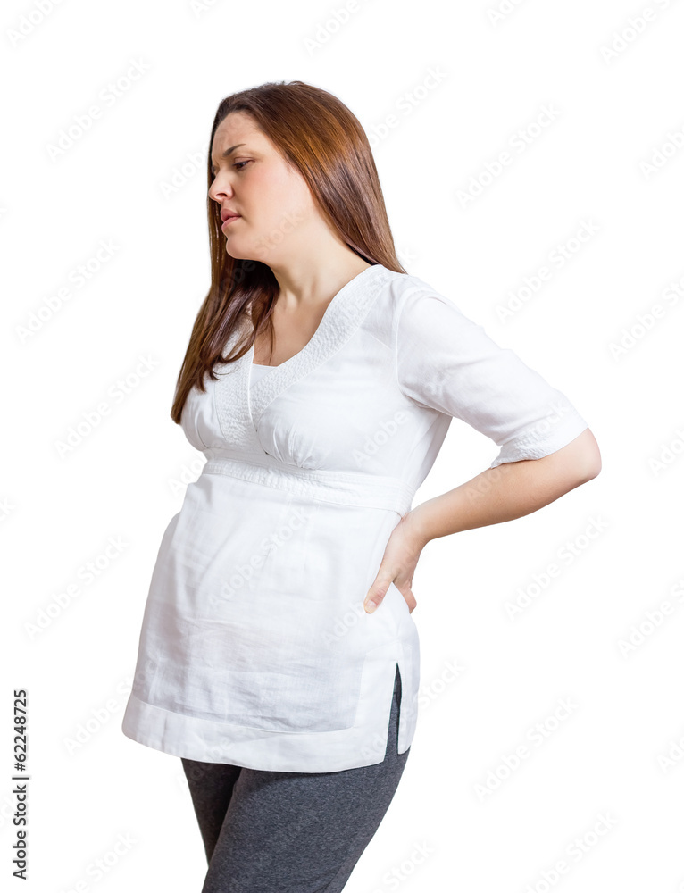 Pregnant woman with strong pain massaging her back Pregnant woman with strong pain massaging her back