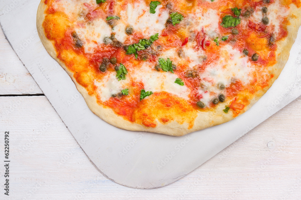 pizza with tomatoes, basil,kapers and mozarela, clouse up pizza with tomatoes, basil,kapers and mozarela, clouse up