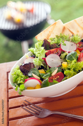 Veggie Healthy fresh vegetarian salad on a picnic table