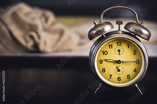 Vintage alarm clock in bedroom