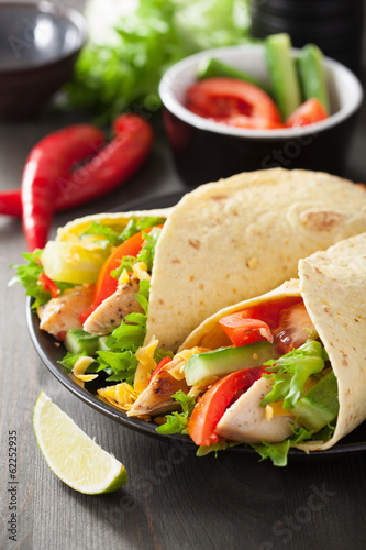 mexican tortilla wrap with chicken breast and vegetables