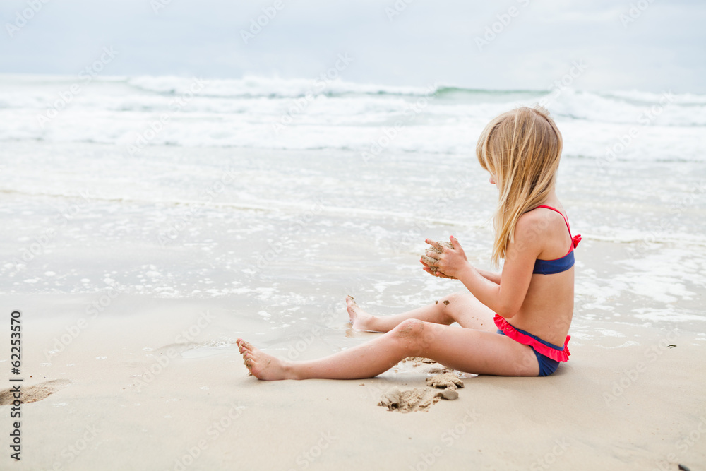 Young girl playing at beach Young girl playing at beach