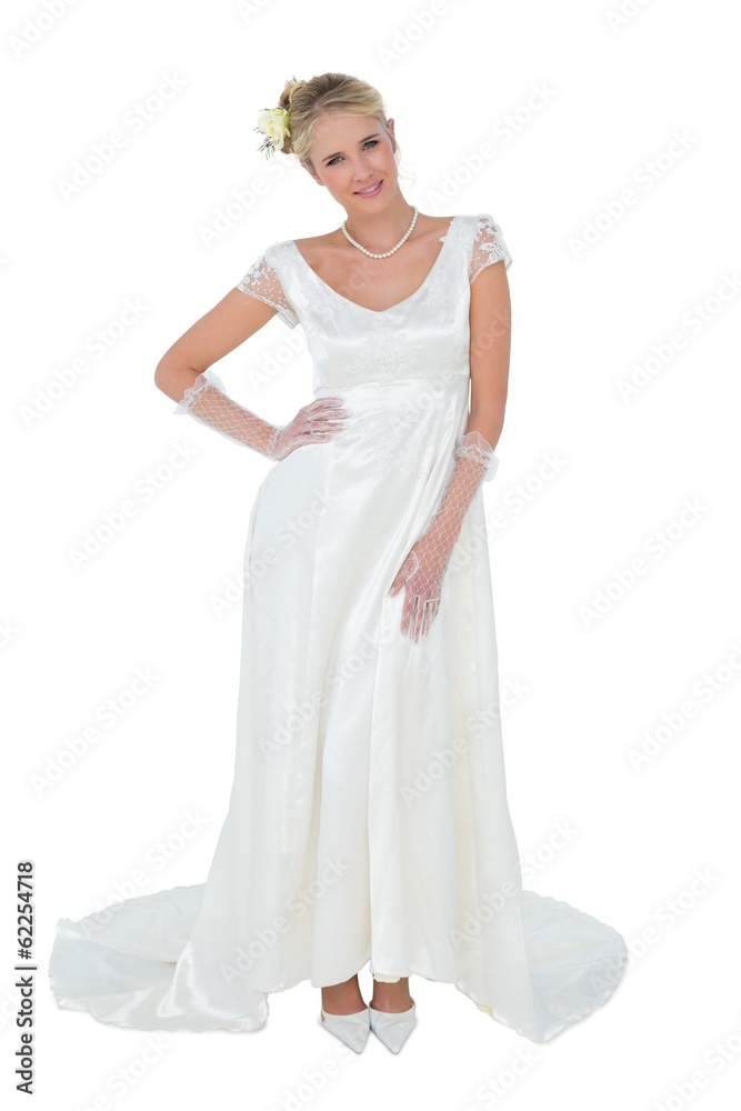 Beautiful bride with hand on waist over white background Beautiful bride with hand on waist over white background