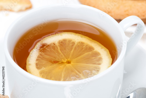 fragrant black tea with lemon, close-up