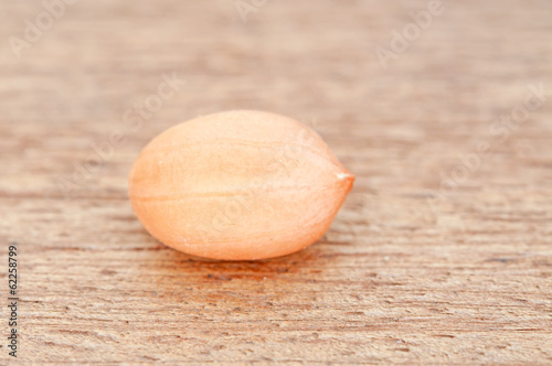 Closeup peanuts on a wooden floor