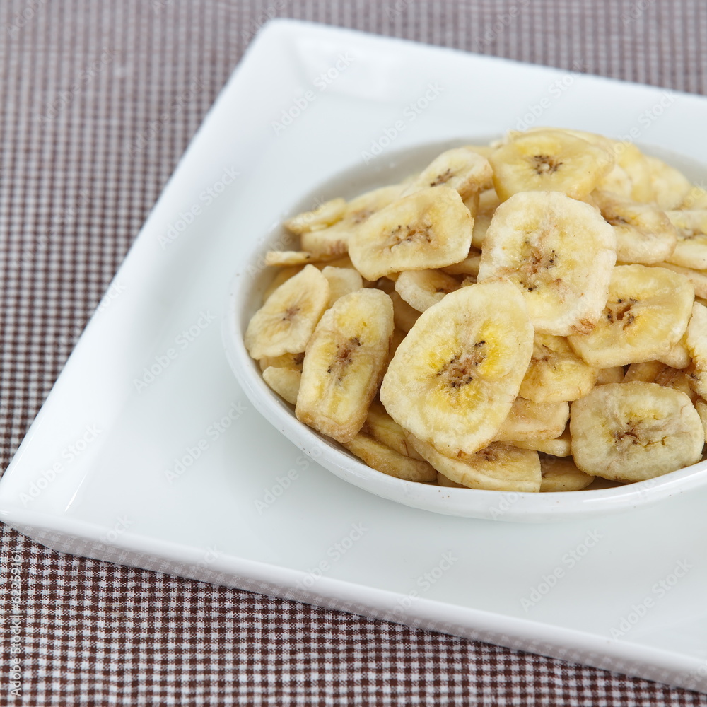 Banana chips, made from dehydrated slices of fresh ripe bananas Banana chips, made from dehydrated slices of fresh ripe bananas