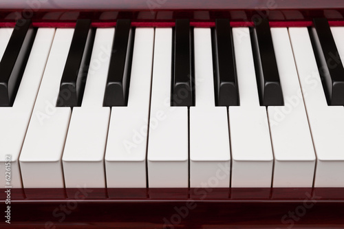 ebony and ivory keys of red piano