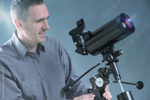 Man with telescope photo