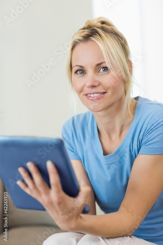 Portrait of a beautiful young woman with digital tablet