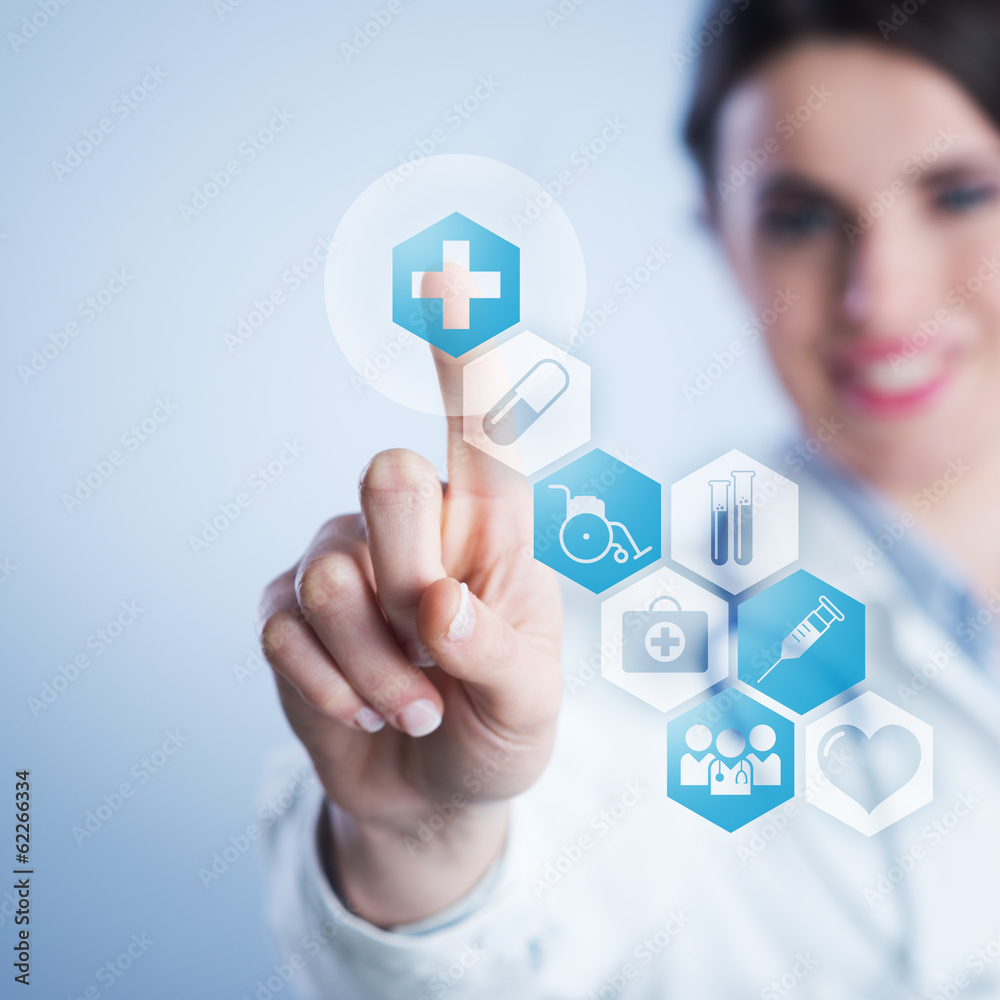 Young female doctor using touch screen interface. Young female doctor using touch screen interface.